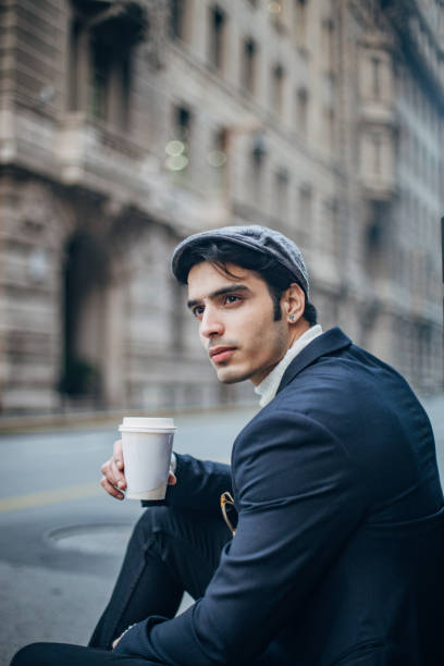 istock Handsome man drinking coffee in the city 1198443603