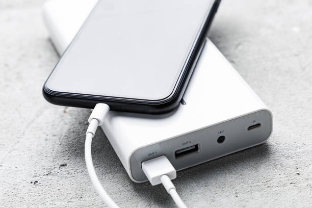 Charging Of Smart Phone From Power Bank Stock Photo - Download Image Now - Power Bank, Charging, Mobile Phone - iStock
