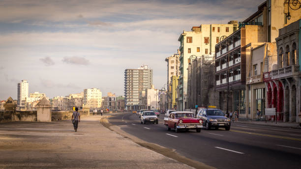 Classical Cars on a Traffic-free Malecon highway, Havana, Cuba stock photo