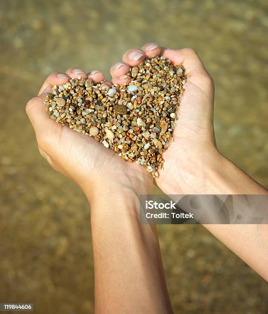 Heart Symbol In Feminine Hand Stock Photo - Download Image Now - Heart Shape, Palm of Hand, Stone - Object