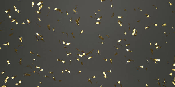 istock Festive golden tinsel on black background 1198446259