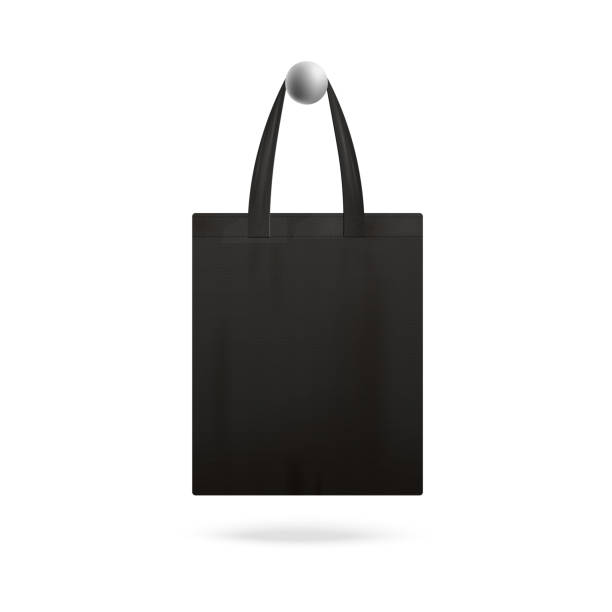 istock Black realistic tote bag mockup hanging on doorknob 1198448149