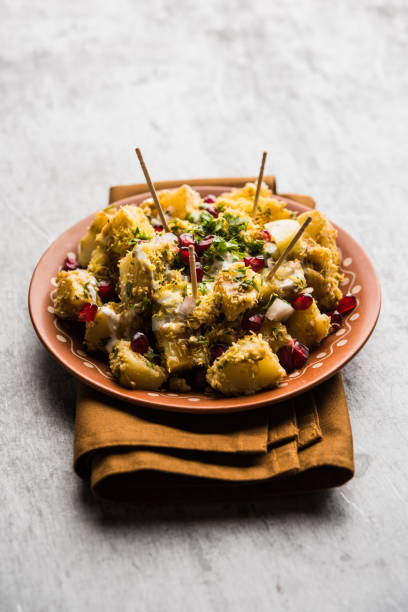 Aloo chaat or Alu chat is a popular street food originating from the Indian subcontinent, especially north India. it's an easy food recipe. stock photo