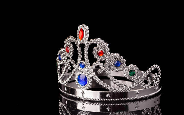 istock plastic princess crown isolated on black background 1198449784