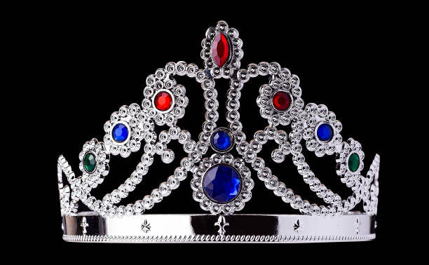 istock plastic princess crown isolated on black background 1198449822