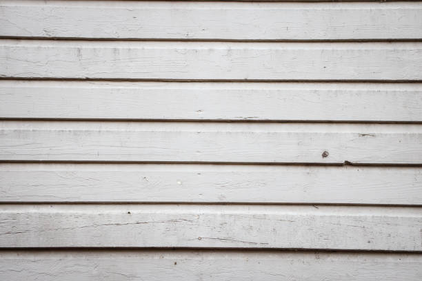 istock Old, white abstract house exterior wall from wood. 1198452851