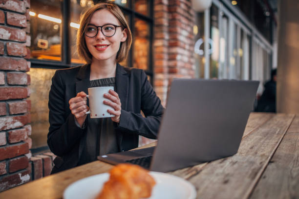 istock Young woman is having coffee 1198453870