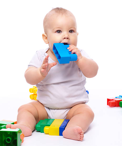 Little boy with building bricks stock photo