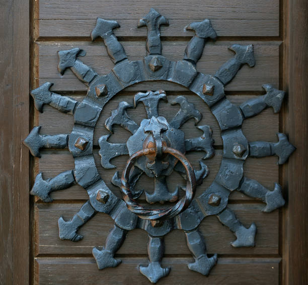 istock Iron knocker of old door. 1198457092