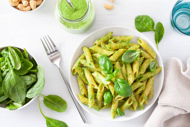 istock penne pasta with spinach basil pesto sauce 1198458971
