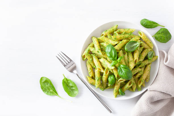 istock penne pasta with spinach basil pesto sauce 1198459201