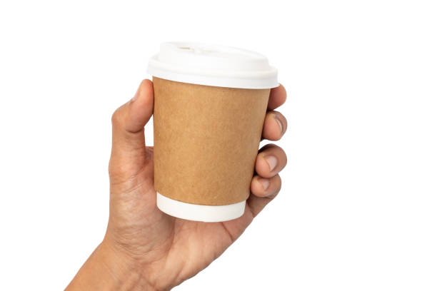 istock man hand holding a Coffee paper cup isolated on white background. 1198459236