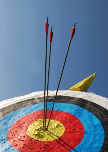 Arrows in the bullseye at the centre of an archery target