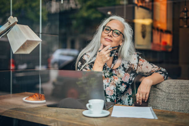istock Senior woman working on laptop 1198461395