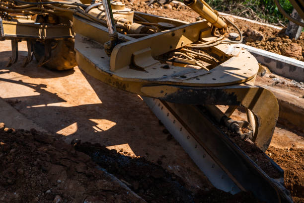 istock Details of grader is working on road construction. Grader industrial machine on construction of new roads. Heavy duty machinery working on highway. Construction equipment. Compaction of the road. 1198461474