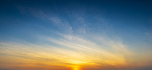 istock Blue sky and clouds with golden hour sun light panorama nature background 1198462330