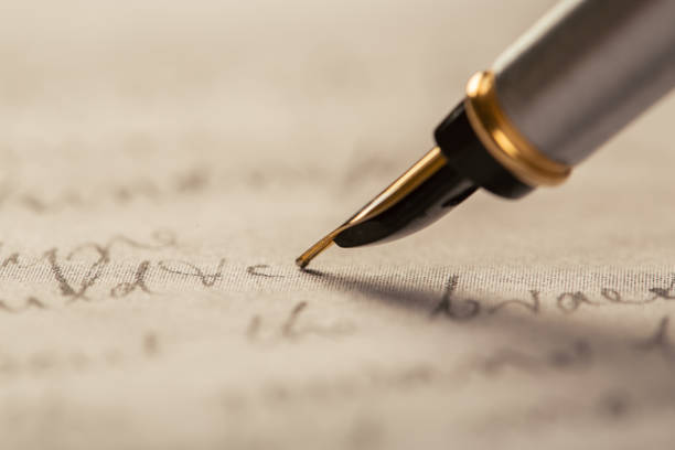 istock Fountain pen on an ancient handwritten letter. Old story. Retro style. 1198462371