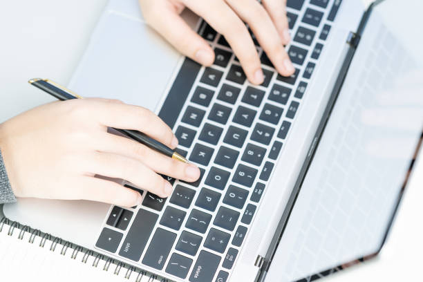 istock Woman working at home office using laptop searching web, browsing information 1198462391