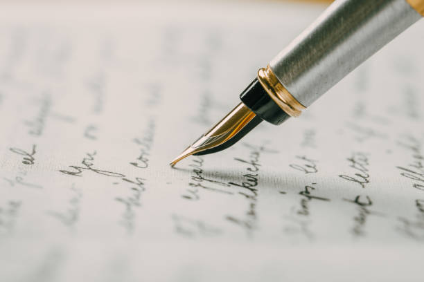 istock Fountain pen on an ancient handwritten letter. Old story. Retro style. 1198462440