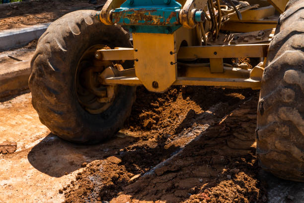 istock Details of grader is working on road construction. Grader industrial machine on construction of new roads. Heavy duty machinery working on highway. Construction equipment. Compaction of the road. 1198464557