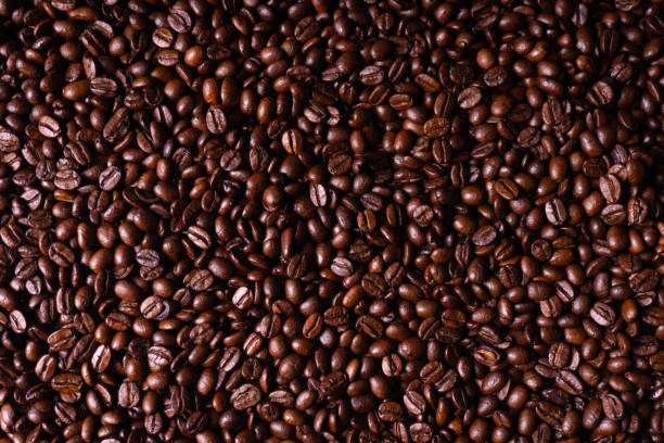 istock Close up of fresh roasted brown coffee beans 1198469268