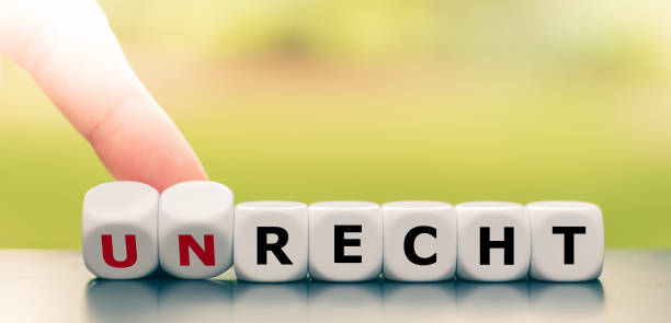 istock Hand turns dice and changes the German word 