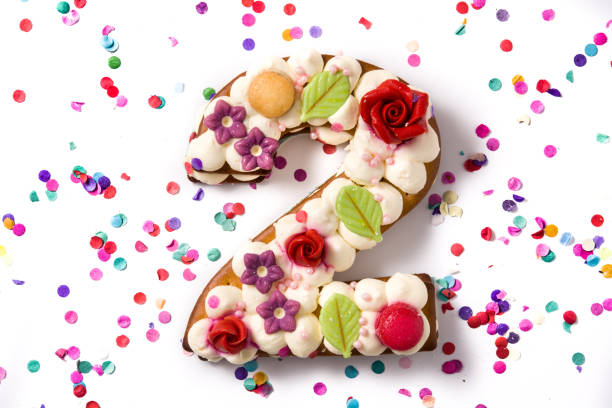 istock Number two cake decorated with flowers and macarons 1198474666