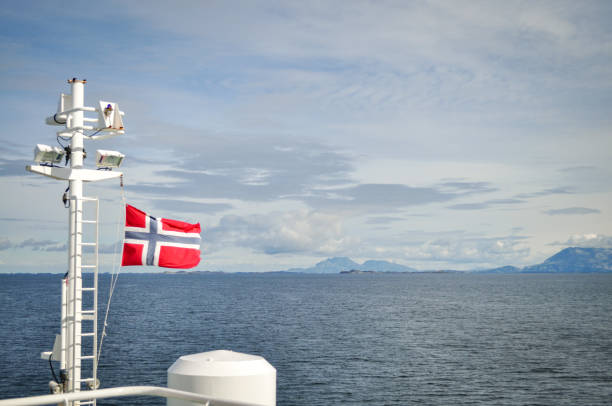 istock Flag of Norway in the wind on a ferry deck 1198474679