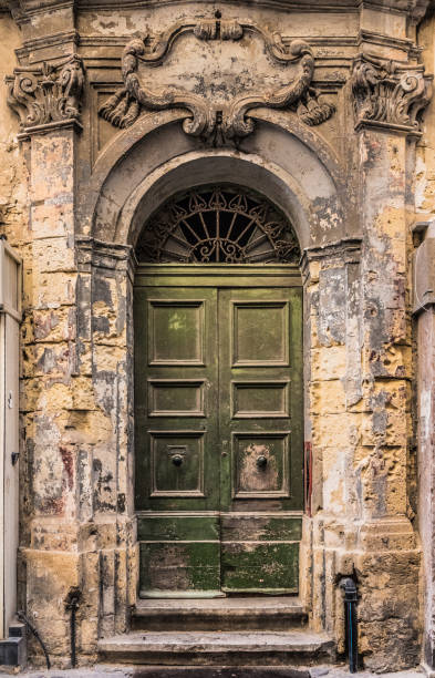 istock Ancient wooden doors with the bullet holes from second world war 1198477881