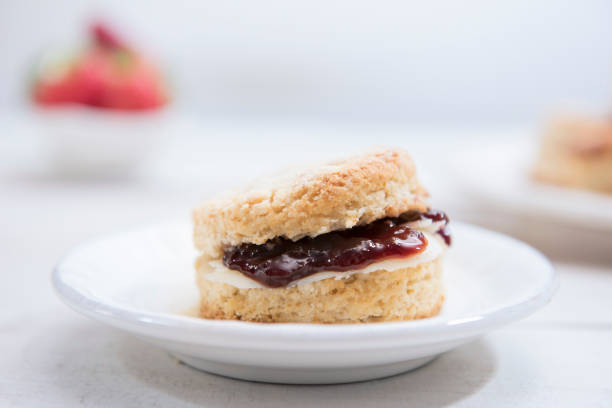 istock Close-up Scones with butter and strawberry jam 1198478385