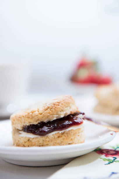 istock Close-up Scones with butter and strawberry jam 1198480820