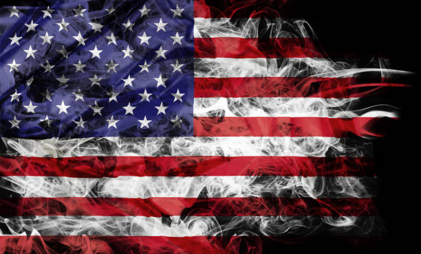 smoke flag of United States Smoke shape of national flag of United States of America isolated on black background. flag backdrop stock pictures, royalty-free photos & images