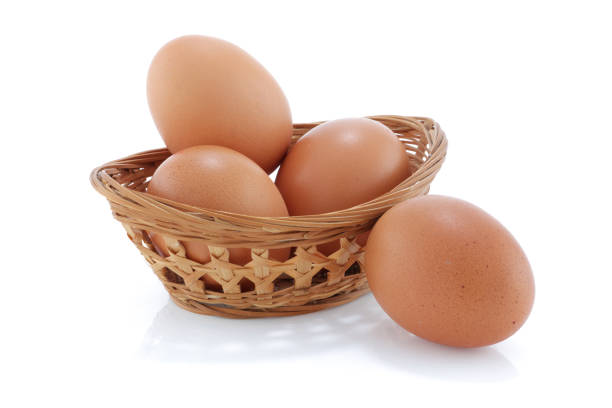 Some Brown chicken eggs in a bamboo basket