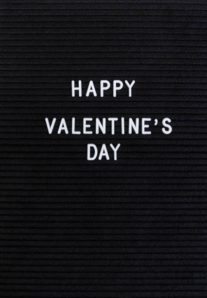 istock The words Happy Valentine's Day on black felt letter board 1198485430