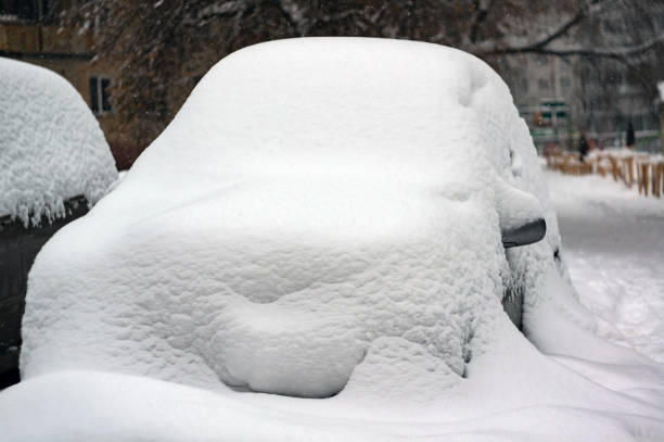 istock Car covered with thick snow after heavy snowfall 1198486198