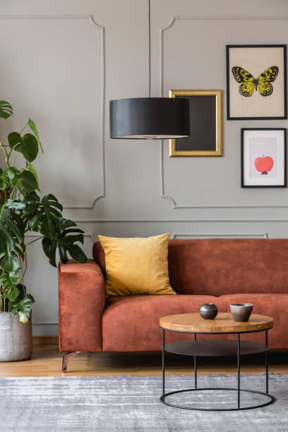 istock Eclectic living room interior with comfortable velvet corner sofa with pillows 1198487827