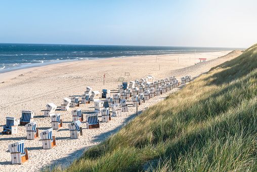 Sand dune in Helgoland under blue sky with clouds, Schleswig-Holstein, Germany