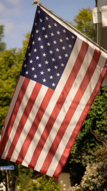 istock American flag outside a building 1198491305