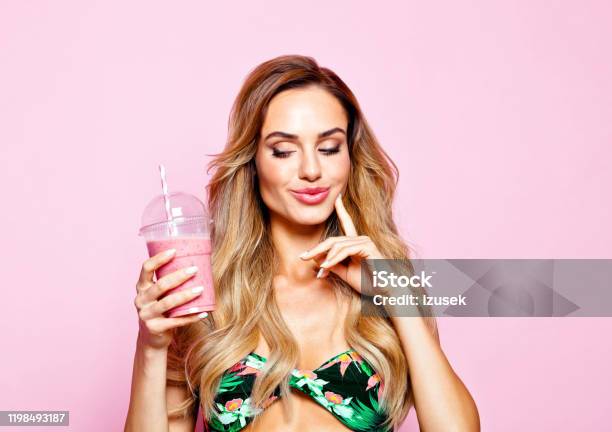 Summer Portrait Of Young Blonde Woman Holding Smoothie Stock Photo - Download Image Now