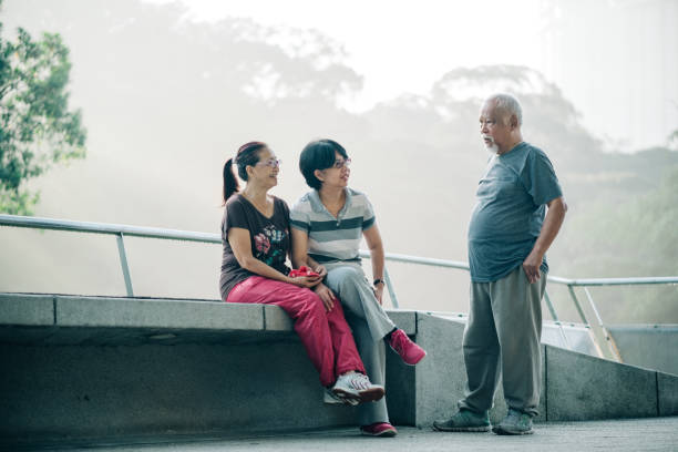 istock Three Senior Multiracial Friendships at The Park 1198496681