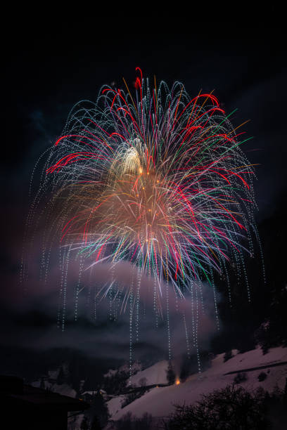 istock firework in the alps, winter season 1198497765