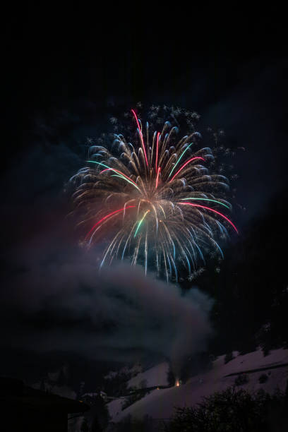 istock firework in the alps, winter season 1198497799