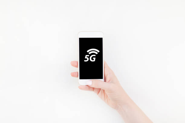 5G network, high-speed mobile Internet, new generation networks concept. Woman hand holding smartphone on white background with copy space. Template for feminine blog social technological media