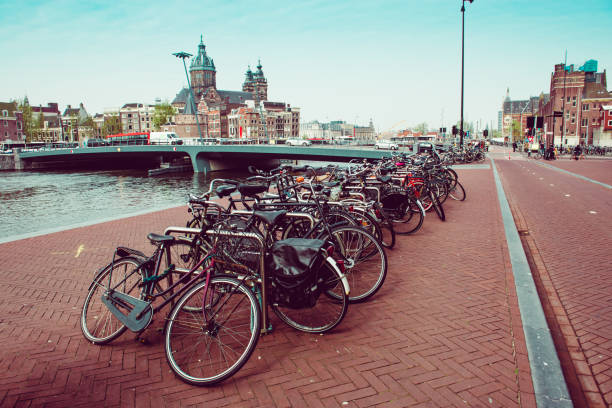 istock Bicycles Parked On Amstel River Quay In Amsterdam, The Netherlands 1198503698