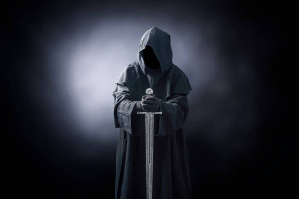 istock Ghostly figure with medieval sword in the dark 1198503882