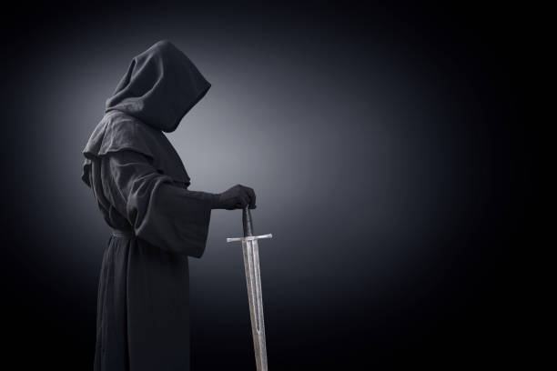 istock Ghostly figure with medieval sword in the dark 1198503913