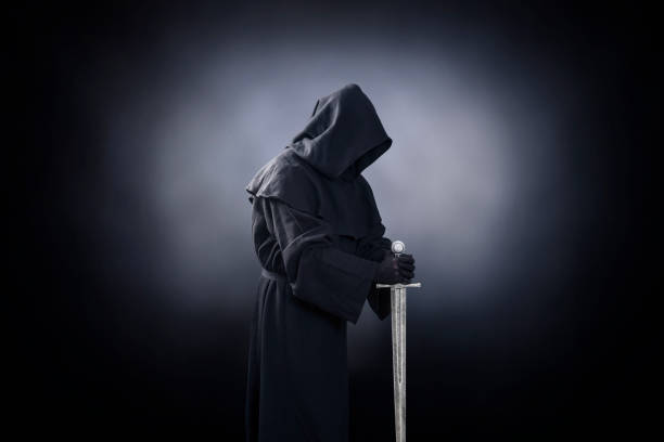 istock Ghostly figure with medieval sword in the dark 1198503943