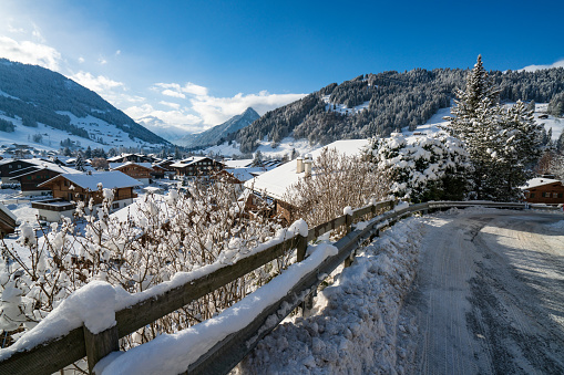 Gstaad, Switzerland - 02.01.2019: Winter panoramic view of Gstaad village from a street above
