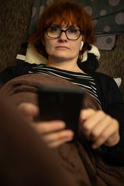 istock a woman using smartphone at home 1198505088
