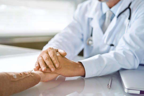 istock Doctor and patient are discussing something, just hands at the table 1198510226